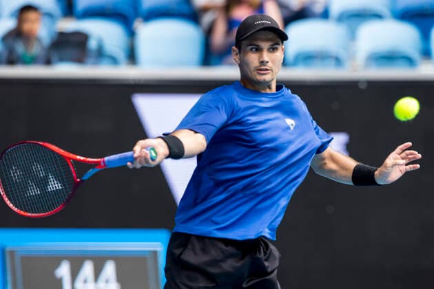 MELBOURNE, VIC - FEBRUARY 08: Marcos Giron of the United States of America returns the ball during round 1 of the 2021 Australian Open on February 8 2020, at Melbourne Park in Melbourne, Australia. (Photo by Jason Heidrich Icon Sportswire) TENNIS: FEB 08 Australian Open Icon2102081391
