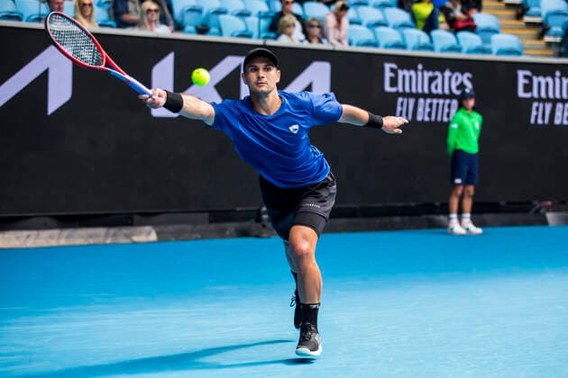MELBOURNE, VIC - FEBRUARY 08: Marcos Giron of the United States of America returns the ball during round 1 of the 2021 Australian Open on February 8 2020, at Melbourne Park in Melbourne, Australia. (Photo by Jason Heidrich Icon Sportswire) TENNIS: FEB 08 Australian Open Icon2102081451