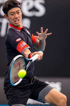 MELBOURNE, VIC - FEBRUARY 08: Kei Nishikori of Japan returns the ball during round 1 of the 2021 Australian Open on February 8 2020, at Melbourne Park in Melbourne, Australia. (Photo by Jason Heidrich Icon Sportswire) TENNIS: FEB 08 Australian Open Icon2102082101