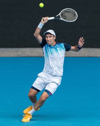 (210208) -- MELBOURNE, Feb. 8, 2021 -- Mikhail Kukushkin returns a shot during the men s singles first round match between Dominic Thiem of Austria and Mikhail Kukushkin of Kazakhstan in Melbourne Park, Melbourne, Australia on Feb. 8, 2021. (Photo by Xinhua) (SP)AUSTRALIA-MELBOURNE-TENNIS-AUSTRALIAN OPEN HuxJingchen 
