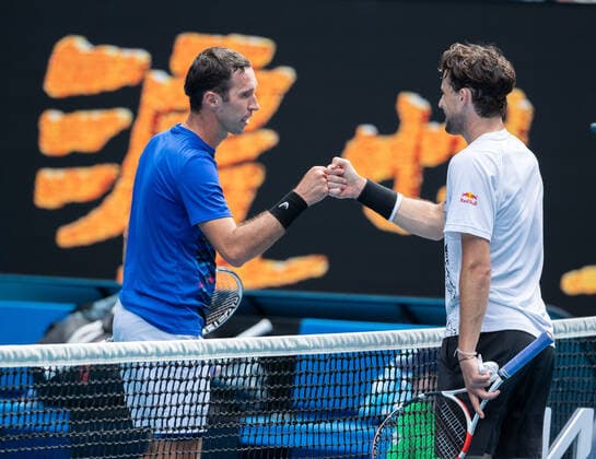 (210208) -- MELBOURNE, Feb. 8, 2021 -- Dominic Thiem of Austria (R) greets Mikhail Kukushkin of Kazakhstan after the men s singles first round match in Melbourne Park, Melbourne, Australia on Feb. 8, 2021. (Photo by Xinhua) (SP)AUSTRALIA-MELBOURNE-TENNIS-AUSTRALIAN OPEN HuxJingchen 