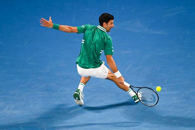 TENNIS AUSTRALIAN OPEN, Novak Djokovic of Serbia in action during his first Round Men s singles match against Jeremy Chardy of the United States of America on Day 1 of the Australian Open at Melbourne Park in Melbourne, Monday, February 8, 2021. ( NO ARCHIVING, EDITORIAL USE ONLY, NO USE IN BOOKS WITHOUT CONSENT MELBOURNE VIC AUSTRALIA  Copyright: xDAVExHUNTx 20210208001519172438