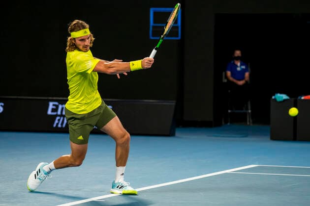 MELBOURNE, VIC - FEBRUARY 09: Stefanos Tsitsipas of Greece returns the ball during round 1 of the 2021 Australian Open on February 9 2020, at Melbourne Park in Melbourne, Australia. (Photo by Jason Heidrich Icon Sportswire) TENNIS: FEB 09 Australian Open Icon2102092052