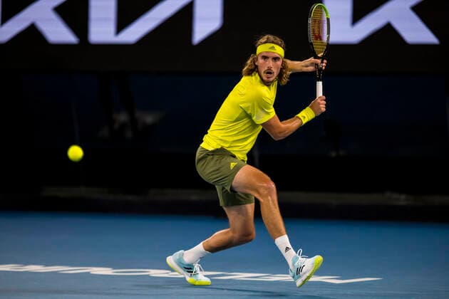 MELBOURNE, VIC - FEBRUARY 09: Stefanos Tsitsipas of Greece returns the ball during round 1 of the 2021 Australian Open on February 9 2020, at Melbourne Park in Melbourne, Australia. (Photo by Jason Heidrich Icon Sportswire) TENNIS: FEB 09 Australian Open Icon2102092112