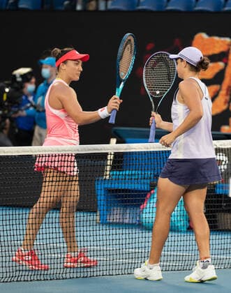(210209) -- MELBOURNE, Feb. 9, 2021 -- Ashleigh Barty (R) of Australia greets Danka Kovinic of Montenegro after the women s singles first round match between Ashleigh Barty of Australia and Danka Kovinic of Montenegro at the Australian Open in Melbourne Park, Melbourne, Australia on Feb. 9, 2021. (Photo by Hu Jingchen Xinhua) (SP)AUSTRALIA-MELBOURNE-TENNIS-AUSTRALIAN OPEN-DAY 2 BaixXuefeihujingchen 