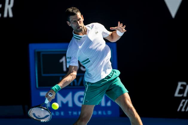 MELBOURNE, VIC - FEBRUARY 10: Novak Djokovic of Serbia returns the ball during round 2 of the 2021 Australian Open on February 10 2020, at Melbourne Park in Melbourne, Australia. (Photo by Jason Heidrich Icon Sportswire) TENNIS: FEB 10 Australian Open Icon2102100923
