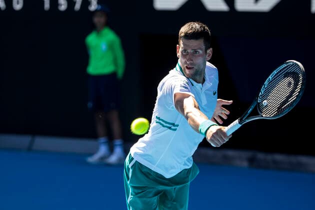 MELBOURNE, VIC - FEBRUARY 10: Novak Djokovic of Serbia returns the ball during round 2 of the 2021 Australian Open on February 10 2020, at Melbourne Park in Melbourne, Australia. (Photo by Jason Heidrich Icon Sportswire) TENNIS: FEB 10 Australian Open Icon2102100943