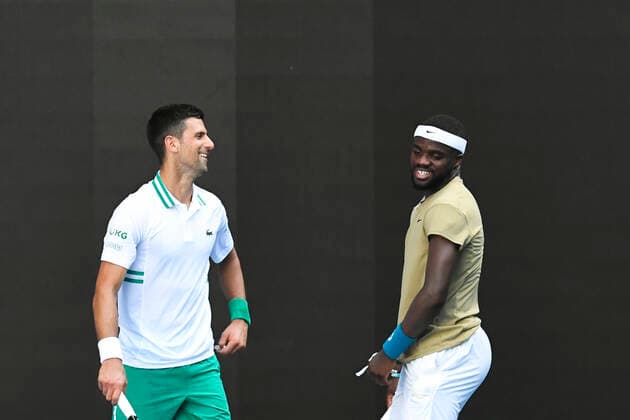 TENNIS AUSTRALIAN OPEN, Novak Djokovic of Serbia (left) and Frances Tiafoe of the United States of America share a laugh during their second Round Men s singles match on Day 3 of the Australian Open at Melbourne Park in Melbourne, Wednesday, February 10, 2021. ( NO ARCHIVING, EDITORIAL USE ONLY, NO USE IN BOOKS WITHOUT CONSENT MELBOURNE VIC AUSTRALIA  Copyright: xDAVExHUNTx 20210210001519570590