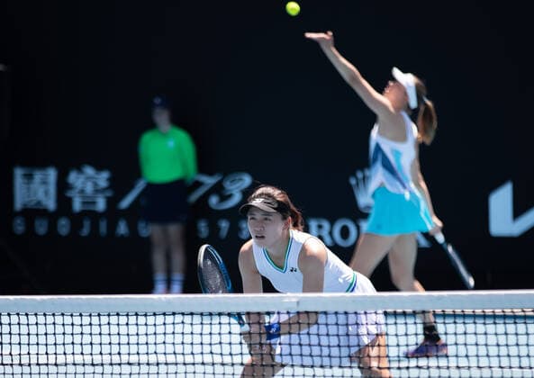 (210210) -- MELBOURNE, Feb. 10, 2021 -- Zhu Lin (front) Mona Barthel compete during the women s doubles first round match between Zhu Lin (China) Mona Barthel (Germany) and Aliaksandra Sasnovich (Belarus) Marta Kostyuk (Ukraine) at the Australian Open in Melbourne Park, Melbourne, Australia on Feb. 10, 2021. (Photo by Xinhua) (SP)AUSTRALIA-MELBOURNE-TENNIS-AUSTRALIAN OPEN-DAY 3 HuxJingchen 