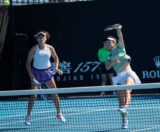 (210210) -- MELBOURNE, Feb. 10, 2021 -- Yang Zhaoxuan Xu Yifan (R) compete during the women s doubles first round match between Yang Zhaoxuan Xu Yifan of China and Russia s Anastasia Pavlyuchenkova Latvia s Anastasija Sevastova at the Australian Open in Melbourne Park, Melbourne, Australia on Feb. 10, 2021. (Photo by Hu Jingchen Xinhua) (SP)AUSTRALIA-MELBOURNE-TENNIS-AUSTRALIAN OPEN-DAY 3 BaixXuefeihujingchen 