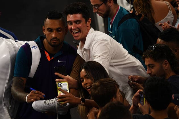 TENNIS AUSTRALIAN OPEN, Nick Kyrgios (left) of Australia signs an autograph for a fan after winning his Men s singles match against Ugo Humbert of France on Day 3 of the Australian Open at Melbourne Park in Melbourne, Wednesday, February 10, 2021. ( NO ARCHIVING, EDITORIAL USE ONLY, NO USE IN BOOKS WITHOUT CONSENT MELBOURNE VIC AUSTRALIA  Copyright: xJAMESxROSSx 20210211001519619161