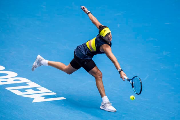 MELBOURNE, VIC - FEBRUARY 14: Garbine Muguruza of Spain returns the ball during round 4 of the 2021 Australian Open on February 14 2020, at Melbourne Park in Melbourne, Australia. (Photo by Jason Heidrich Icon Sportswire) TENNIS: FEB 14 Australian Open Icon2102140507