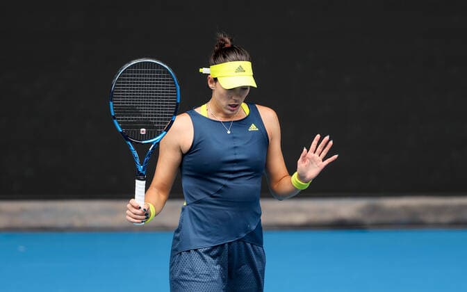 (210214) -- MELBOURNE, Feb. 14, 2021 -- Garbine Muguruza reacts during the women s singles 4th round match between Osaka Naomi of Japan and Garbine Muguruza of Spain at the Australian Open 2021 tennis tournament in Melbourne Park, Melbourne, Australia, on Feb. 14, 2021. ) (SP)AUSTRALIA-MELBOURNE-TENNIS-AUSTRALIAN OPEN-DAY 7 BaixXuefei 