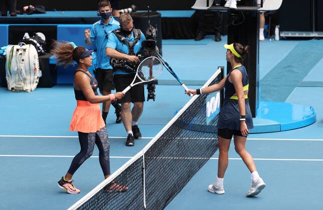 (210214) -- MELBOURNE, Feb. 14, 2021 -- Osaka Naomi (L) and Garbine Muguruza shake their racquet during the women s singles 4th round match between Osaka Naomi of Japan and Garbine Muguruza of Spain at the Australian Open 2021 tennis tournament in Melbourne Park, Melbourne, Australia, on Feb. 14, 2021. ) (SP)AUSTRALIA-MELBOURNE-TENNIS-AUSTRALIAN OPEN-DAY 7 BaixXuefei 