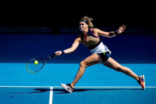 MELBOURNE, VIC - FEBRUARY 14: Aryna Sabalenka of Belarus returns the ball during round 4 of the 2021 Australian Open on February 14 2020, at Melbourne Park in Melbourne, Australia. (Photo by Jason Heidrich Icon Sportswire) TENNIS: FEB 14 Australian Open Icon2102140977