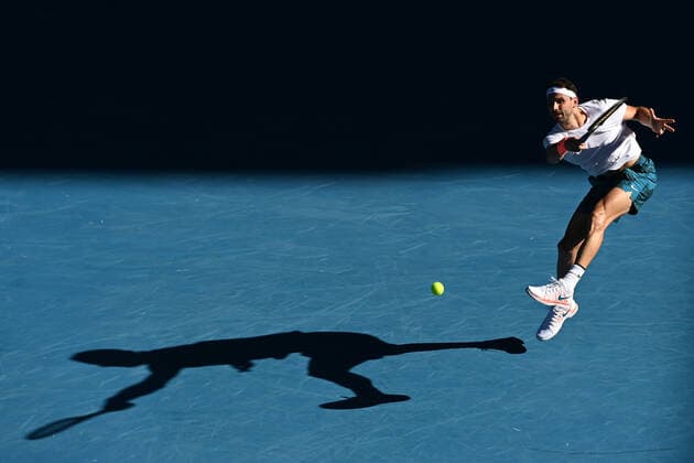 TENNIS AUSTRALIAN OPEN, Grigor Dimitrov of Bulgaria in action during his fourth Round Men s singles match against Dominic Thiem of Austria on Day 7 of the Australian Open at Melbourne Park in Melbourne, Sunday, February 14, 2021. ( NO ARCHIVING, EDITORIAL USE ONLY, NO USE IN BOOKS WITHOUT CONSENT MELBOURNE VIC AUSTRALIA  Copyright: xDAVExHUNTx 20210214001520493469