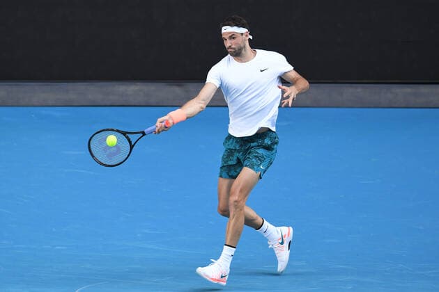 TENNIS AUSTRALIAN OPEN, Grigor Dimitrov of Bulgaria in action during his fourth Round Men s singles match against Dominic Thiem of Austria on Day 7 of the Australian Open at Melbourne Park in Melbourne, Sunday, February 14, 2021. ( NO ARCHIVING, EDITORIAL USE ONLY, NO USE IN BOOKS WITHOUT CONSENT MELBOURNE VIC AUSTRALIA  Copyright: xDAVExHUNTx 20210214001520494365
