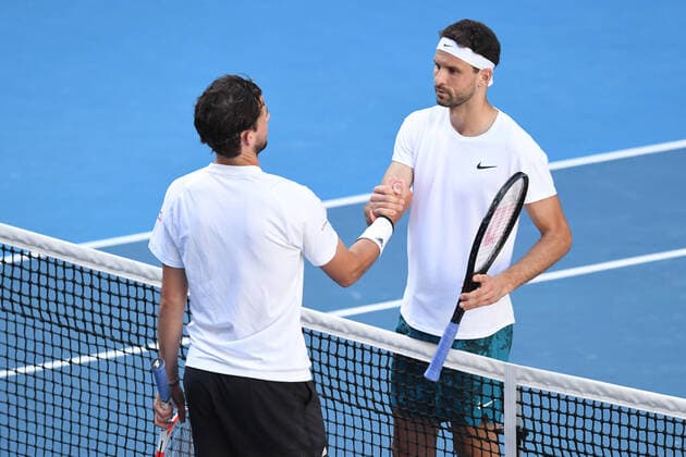 TENNIS AUSTRALIAN OPEN, Grigor Dimitrov (R) of Bulgaria shakes hands with Dominic Thiem of Austria after winning his fourth Round Men s singles match on Day 7 of the Australian Open at Melbourne Park in Melbourne, Sunday, February 14, 2021. ( NO ARCHIVING, EDITORIAL USE ONLY, NO USE IN BOOKS WITHOUT CONSENT MELBOURNE VIC AUSTRALIA  Copyright: xDAVExHUNTx 20210214001520496302