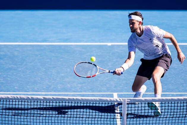 MELBOURNE, VIC - FEBRUARY 14: Dominic Thiem of Austria returns the ball during round 4 of the 2021 Australian Open on February 14 2020, at Melbourne Park in Melbourne, Australia. (Photo by Jason Heidrich Icon Sportswire) TENNIS: FEB 14 Australian Open Icon2102141177