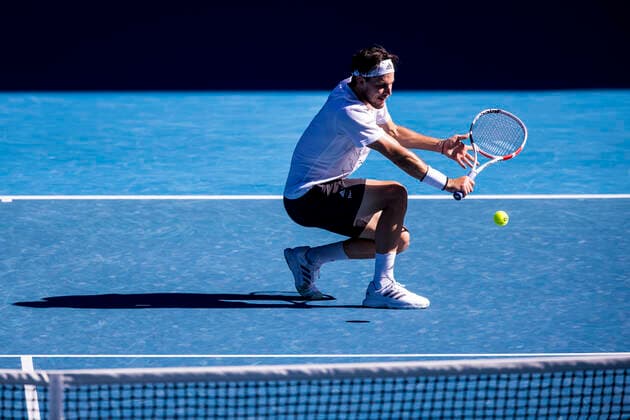 MELBOURNE, VIC - FEBRUARY 14: Dominic Thiem of Austria returns the ball during round 4 of the 2021 Australian Open on February 14 2020, at Melbourne Park in Melbourne, Australia. (Photo by Jason Heidrich Icon Sportswire) TENNIS: FEB 14 Australian Open Icon2102141207