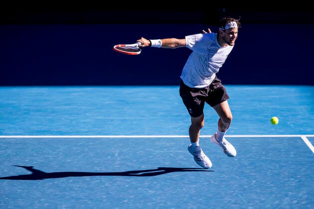 MELBOURNE, VIC - FEBRUARY 14: Dominic Thiem of Austria returns the ball during round 4 of the 2021 Australian Open on February 14 2020, at Melbourne Park in Melbourne, Australia. (Photo by Jason Heidrich Icon Sportswire) TENNIS: FEB 14 Australian Open Icon2102141227