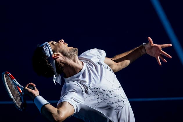 MELBOURNE, VIC - FEBRUARY 14: Dominic Thiem of Austria serves the ball during round 4 of the 2021 Australian Open on February 14 2020, at Melbourne Park in Melbourne, Australia. (Photo by Jason Heidrich Icon Sportswire) TENNIS: FEB 14 Australian Open Icon2102141327