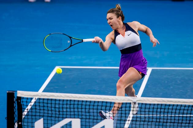 MELBOURNE, VIC - FEBRUARY 14: Simona Halep of Romania returns the ball during round 4 of the 2021 Australian Open on February 14 2020, at Melbourne Park in Melbourne, Australia. (Photo by Jason Heidrich Icon Sportswire) TENNIS: FEB 14 Australian Open Icon2102141737
