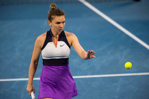 MELBOURNE, VIC - FEBRUARY 14: Simona Halep of Romania prepares to serve the ball during round 4 of the 2021 Australian Open on February 14 2020, at Melbourne Park in Melbourne, Australia. (Photo by Jason Heidrich Icon Sportswire) TENNIS: FEB 14 Australian Open Icon2102141757