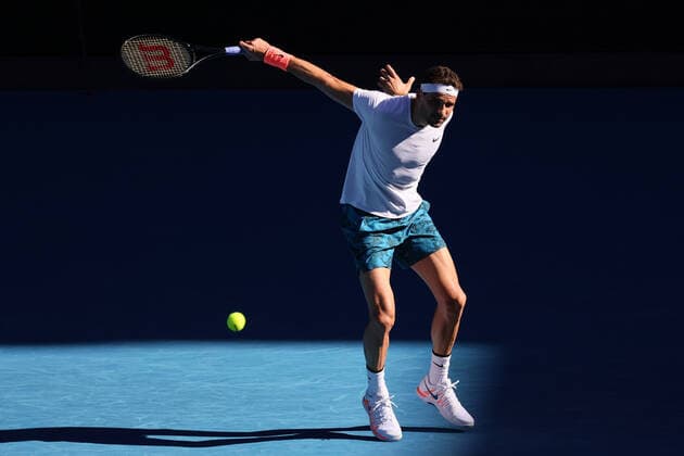 February 14, 2021: 18th seed Grigor DIMITROV of Bulgaria in action against 3rd seed Dominic THIEM of Austria in a 4th round match on day 7 of the 2021 Australian Open on Rod Laver Arena, in Melbourne, Australia. Cal Media. Melbourne Australia - ZUMAc04_ 20210214_zaf_c04_051 Copyright: xSydneyxLowx