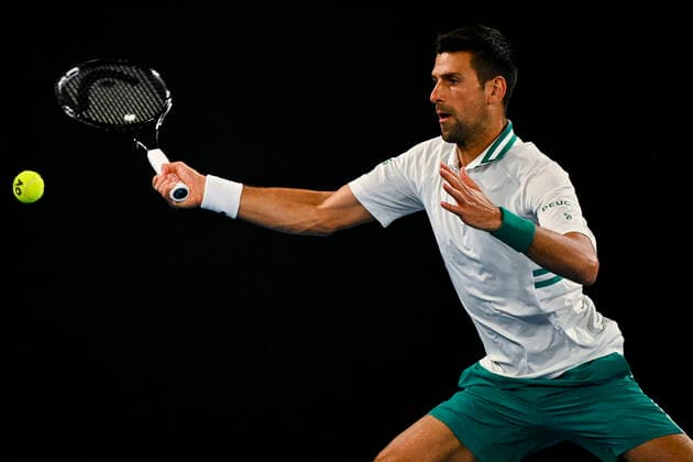 TENNIS AUSTRALIAN OPEN, Novak Djokovic of Serbia in action during his fourth Round Men s singles match against Milos Raonic of Canada on Day 7 of the Australian Open at Melbourne Park in Melbourne, Sunday, February 14, 2021. ( NO ARCHIVING, EDITORIAL USE ONLY, NO USE IN BOOKS WITHOUT CONSENT MELBOURNE VIC AUSTRALIA  Copyright: xDEANxLEWINSx 20210214001520518494