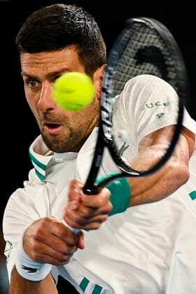 TENNIS AUSTRALIAN OPEN, Novak Djokovic of Serbia in action during his fourth Round Men s singles match against Milos Raonic of Canada on Day 7 of the Australian Open at Melbourne Park in Melbourne, Sunday, February 14, 2021. ( NO ARCHIVING, EDITORIAL USE ONLY, NO USE IN BOOKS WITHOUT CONSENT MELBOURNE VIC AUSTRALIA  Copyright: xDEANxLEWINSx 20210214001520519148