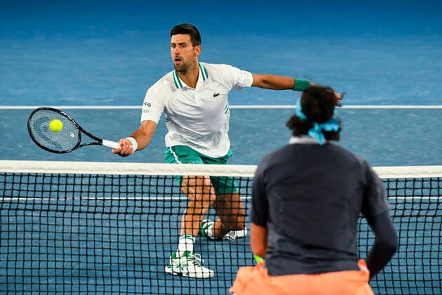 TENNIS AUSTRALIAN OPEN, Novak Djokovic of Serbia in action during his fourth Round Men s singles match against Milos Raonic of Canada on Day 7 of the Australian Open at Melbourne Park in Melbourne, Sunday, February 14, 2021. ( NO ARCHIVING, EDITORIAL USE ONLY, NO USE IN BOOKS WITHOUT CONSENT MELBOURNE VIC AUSTRALIA  Copyright: xDAVExHUNTx 20210214001520522761
