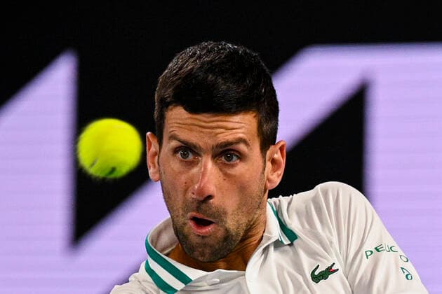 TENNIS AUSTRALIAN OPEN, Novak Djokovic of Serbia in action during his fourth Round Men s singles match against Milos Raonic of Canada on Day 7 of the Australian Open at Melbourne Park in Melbourne, Sunday, February 14, 2021. ( NO ARCHIVING, EDITORIAL USE ONLY, NO USE IN BOOKS WITHOUT CONSENT MELBOURNE VIC AUSTRALIA  Copyright: xDEANxLEWINSx 20210214001520525608