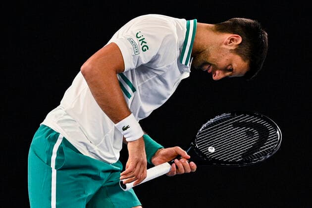 TENNIS AUSTRALIAN OPEN, Novak Djokovic of Serbia reacts during his fourth Round Men s singles match against Milos Raonic of Canada on Day 7 of the Australian Open at Melbourne Park in Melbourne, Sunday, February 14, 2021. ( NO ARCHIVING, EDITORIAL USE ONLY, NO USE IN BOOKS WITHOUT CONSENT MELBOURNE VIC AUSTRALIA  Copyright: xDEANxLEWINSx 20210214001520525709