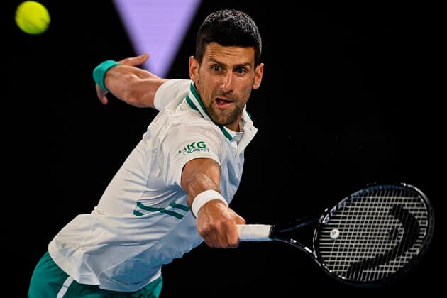 TENNIS AUSTRALIAN OPEN, Novak Djokovic of Serbia in action during his fourth Round Men s singles match against Milos Raonic of Canada on Day 7 of the Australian Open at Melbourne Park in Melbourne, Sunday, February 14, 2021. ( NO ARCHIVING, EDITORIAL USE ONLY, NO USE IN BOOKS WITHOUT CONSENT MELBOURNE VIC AUSTRALIA  Copyright: xDEANxLEWINSx 20210214001520525746