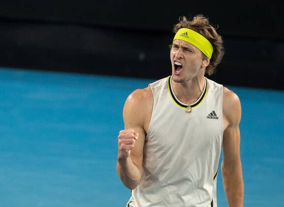 (210214) -- MELBOURNE, Feb. 14, 2021 -- Alexander Zverev reacts during the men s singles 4th round match between Alexander Zverev of Germany and Dusan Lajovic of Serbia at the Australian Open 2021 tennis tournament in Melbourne Park, Melbourne, Australia, on Feb. 14, 2021 (Photo by Xinhua) (SP)AUSTRALIA-MELBOURNE-TENNIS-AUSTRALIAN OPEN-DAY 7 HuxJingchen 