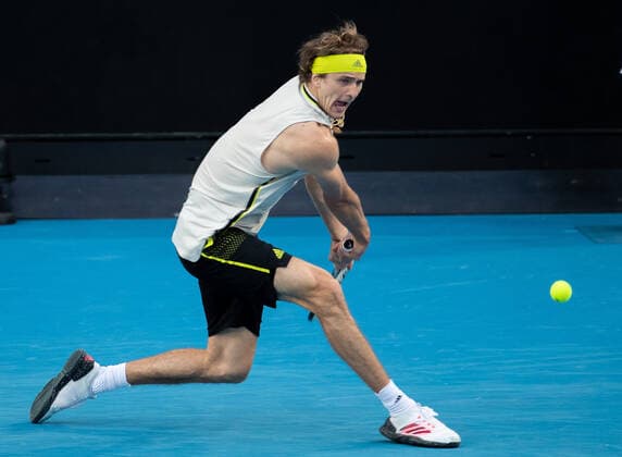 (210214) -- MELBOURNE, Feb. 14, 2021 -- Alexander Zverev hits a return during the men s singles 4th round match between Alexander Zverev of Germany and Dusan Lajovic of Serbia at the Australian Open 2021 tennis tournament in Melbourne Park, Melbourne, Australia, on Feb. 14, 2021 (Photo by Xinhua) (SP)AUSTRALIA-MELBOURNE-TENNIS-AUSTRALIAN OPEN-DAY 7 HuxJingchen 