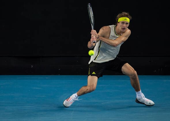 (210214) -- MELBOURNE, Feb. 14, 2021 -- Alexander Zverev hits a return during the men s singles 4th round match between Alexander Zverev of Germany and Dusan Lajovic of Serbia at the Australian Open 2021 tennis tournament in Melbourne Park, Melbourne, Australia, on Feb. 14, 2021 (Photo by Xinhua) (SP)AUSTRALIA-MELBOURNE-TENNIS-AUSTRALIAN OPEN-DAY 7 HuxJingchen 