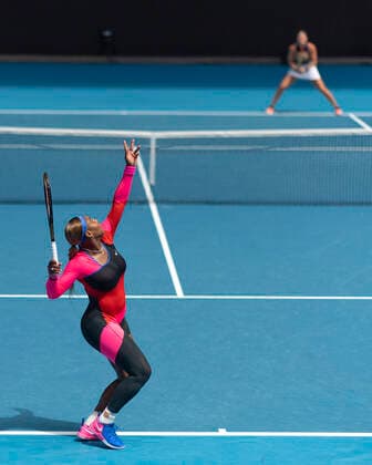 Serena Williams USA serves,opponent Aryna Sabalenka out of focus in the background,from above Copyright: xJuergenxHasenkopfx