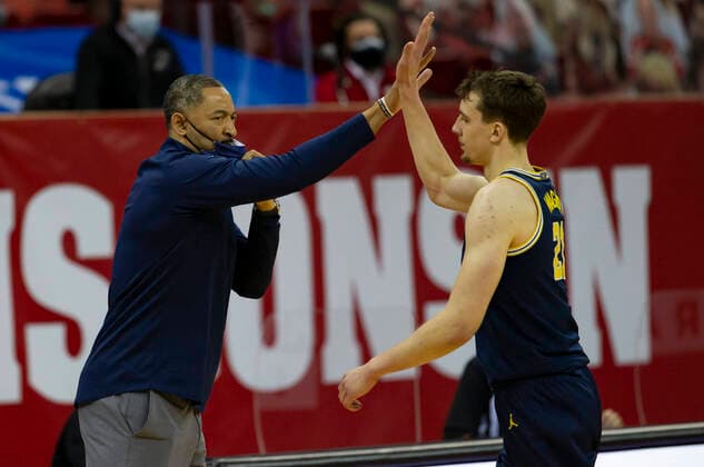 February 14, 2021: Michigan head coach Juwan Howard and Michigan Wolverines guard Franz Wagner 21 during the NCAA, College League, USA basketball game between the Michigan Wolverines and the Wisconsin Badgers at the Kohl Center in Madison, WI. CSM Madison United States of America - ZUMAc04_ 20210214_zaf_c04_062 Copyright: xJohnxFisherx
