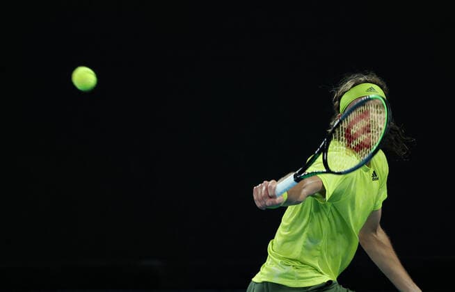 (210217) -- MELBOURNE, Feb. 17, 2021 -- Stefanos Tsitsipas competes during the men s singles quarterfinal match between Rafael Nadal of Spain and Stefanos Tsitsipas of Greece at Australian Open in Melbourne Park, in Melbourne, Australia, on Feb. 17, 2021. ) (SP)AUSTRALIA-MELBOURNE-TENNIS-AUSTRALIAN OPEN-DAY 10 BaixXuefei 