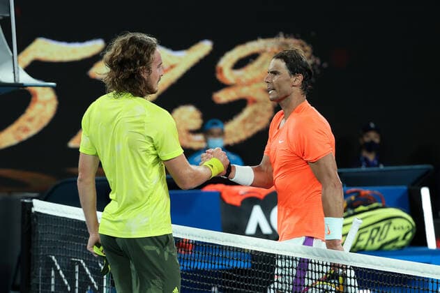 (210217) -- MELBOURNE, Feb. 17, 2021 -- Rafael Nadal (R) shakes hands with Stefanos Tsitsipas after the men s singles quarterfinal match between Rafael Nadal of Spain and Stefanos Tsitsipas of Greece at Australian Open in Melbourne Park, in Melbourne, Australia, on Feb. 17, 2021. ) (SP)AUSTRALIA-MELBOURNE-TENNIS-AUSTRALIAN OPEN-DAY 10 BaixXuefei 