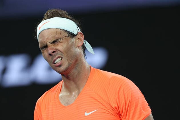 (210217) -- MELBOURNE, Feb. 17, 2021 -- Rafael Nadal reacts during the men s singles quarterfinal match between Rafael Nadal of Spain and Stefanos Tsitsipas of Greece at Australian Open in Melbourne Park, in Melbourne, Australia, on Feb. 17, 2021. ) (SP)AUSTRALIA-MELBOURNE-TENNIS-AUSTRALIAN OPEN-DAY 10 BaixXuefei 