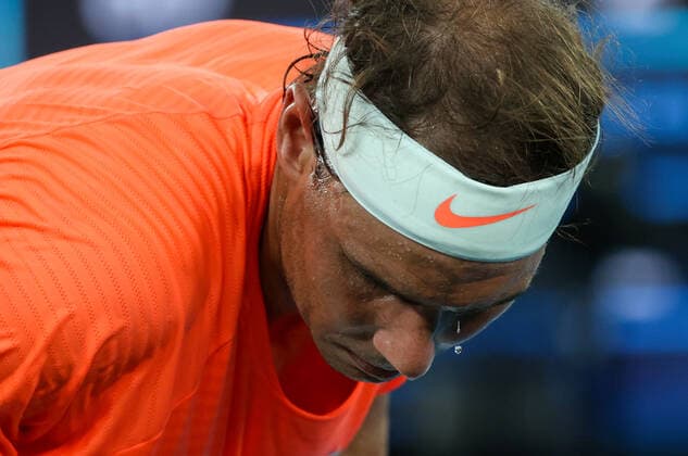 (210217) -- MELBOURNE, Feb. 17, 2021 -- Rafael Nadal reacts during the men s singles quarterfinal match between Rafael Nadal of Spain and Stefanos Tsitsipas of Greece at Australian Open in Melbourne Park, in Melbourne, Australia, on Feb. 17, 2021. ) (SP)AUSTRALIA-MELBOURNE-TENNIS-AUSTRALIAN OPEN-DAY 10 BaixXuefei 