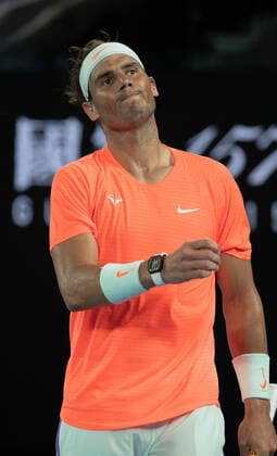 (210217) -- MELBOURNE, Feb. 17, 2021 -- Rafael Nadal reacts during the men s singles quarterfinal match between Rafael Nadal of Spain and Stefanos Tsitsipas of Greece at Australian Open in Melbourne Park, in Melbourne, Australia, on Feb. 17, 2021. (Photo by Xinhua) (SP)AUSTRALIA-MELBOURNE-TENNIS-AUSTRALIAN OPEN-DAY 10 HuxJingchen 