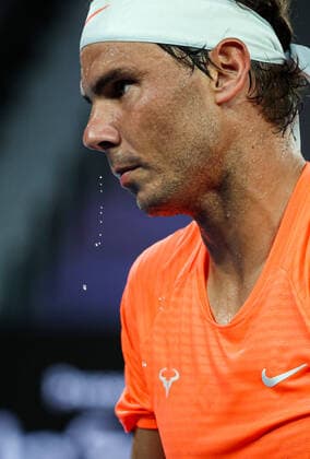 (210217) -- MELBOURNE, Feb. 17, 2021 -- Rafael Nadal reacts during the men s singles quarterfinal match between Rafael Nadal of Spain and Stefanos Tsitsipas of Greece at Australian Open in Melbourne Park, in Melbourne, Australia, on Feb. 17, 2021. ) (SP)AUSTRALIA-MELBOURNE-TENNIS-AUSTRALIAN OPEN-DAY 10 BaixXuefei 