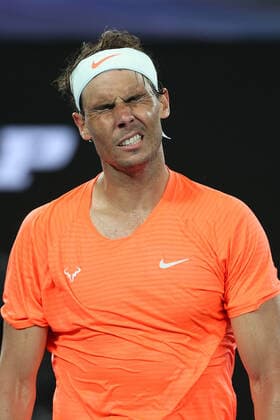 (210217) -- MELBOURNE, Feb. 17, 2021 -- Rafael Nadal reacts during the men s singles quarterfinal match between Rafael Nadal of Spain and Stefanos Tsitsipas of Greece at Australian Open in Melbourne Park, in Melbourne, Australia, on Feb. 17, 2021. ) (SP)AUSTRALIA-MELBOURNE-TENNIS-AUSTRALIAN OPEN-DAY 10 BaixXuefei 