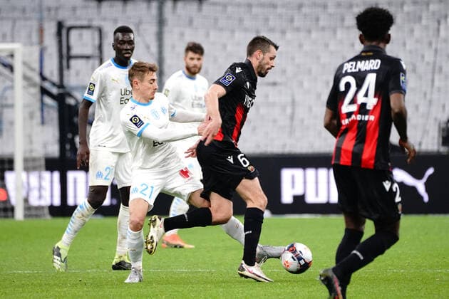 Morgan Schneiderlin (OGC Nice) - Valentin Rongier (Olympique de Marseille) FOOTBALL : Olympique de Marseille vs OGC Nice - Ligue 1 Uber Eats - Marseille - 17 02 2021 NorbertScanella PanoramiC 