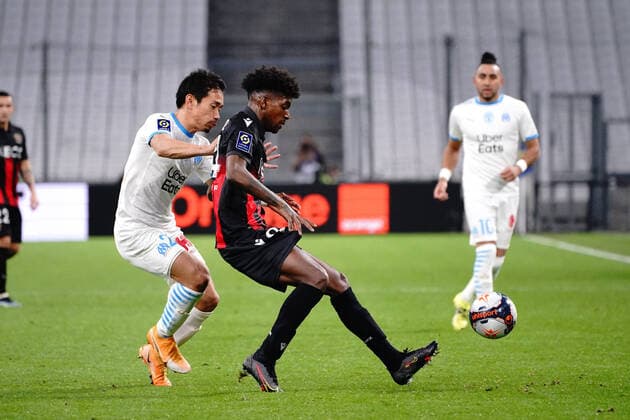 Andy Pelmard (OGC Nice) - Yuko Nagatomo (Olympique de Marseille) FOOTBALL : Olympique de Marseille vs OGC Nice - Ligue 1 Uber Eats - Marseille - 17 02 2021 NorbertScanella PanoramiC 