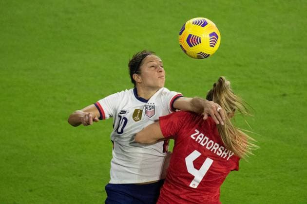Orlando, Florida, Feb 18th 2021: Carli Lloyd ( 10 United States) and Shelina Zadorsky ( 4 Canada) battle for a header during the She Believes Cup match between United States and Canada at Exploria Stadium in Orlando, Florida. Andrea Vilchez SPP She Believes Cup - United States v Canada 